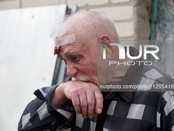 A 75-year-old local resident, Anatolii Staroselets, is suffering from injuries caused by Russian shelling with KAB guided aerial bombs in De...