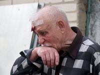 A 75-year-old local resident, Anatolii Staroselets, is suffering from injuries caused by Russian shelling with KAB guided aerial bombs in De...