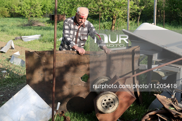 A 75-year-old local resident, Anatolii Staroselets, is suffering from injuries caused by Russian shelling with KAB guided aerial bombs in De...