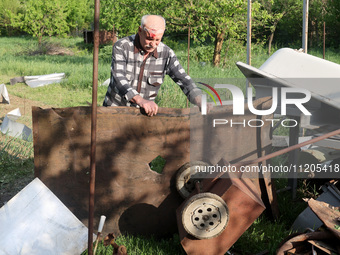 A 75-year-old local resident, Anatolii Staroselets, is suffering from injuries caused by Russian shelling with KAB guided aerial bombs in De...