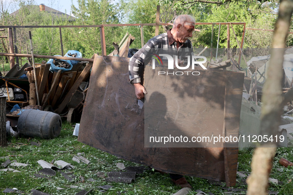 A 75-year-old local resident, Anatolii Staroselets, is suffering from injuries caused by Russian shelling with KAB guided aerial bombs in De...