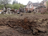 A crater is being caused by Russian shelling with KAB guided aerial bombs in the yard of a private house in Derhachi, Kharkiv Region, northe...