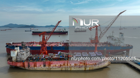 Workers are repairing ships in Zhoushan, China, on May 3, 2024. 