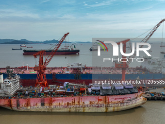 Workers are repairing ships in Zhoushan, China, on May 3, 2024. (