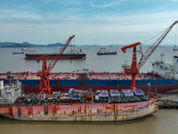 Workers are repairing ships in Zhoushan, China, on May 3, 2024. (