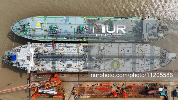 Workers are repairing ships in Zhoushan, China, on May 3, 2024. 