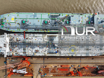 Workers are repairing ships in Zhoushan, China, on May 3, 2024. (