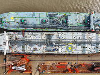 Workers are repairing ships in Zhoushan, China, on May 3, 2024. (