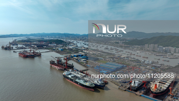 Workers are repairing ships in Zhoushan, China, on May 3, 2024. 