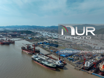 Workers are repairing ships in Zhoushan, China, on May 3, 2024. (