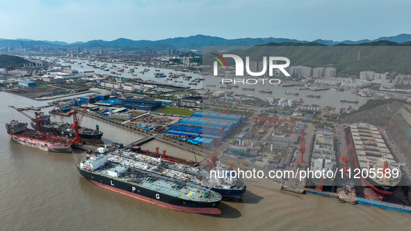 Workers are repairing ships in Zhoushan, China, on May 3, 2024. 