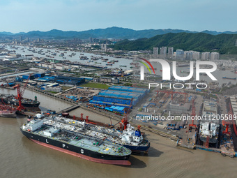 Workers are repairing ships in Zhoushan, China, on May 3, 2024. (