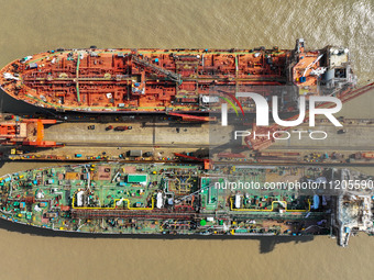 Workers are repairing ships in Zhoushan, China, on May 3, 2024. (