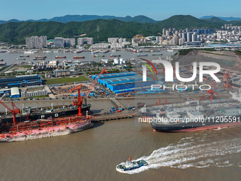 Workers are repairing ships in Zhoushan, China, on May 3, 2024. (