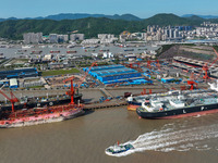 Workers are repairing ships in Zhoushan, China, on May 3, 2024. (