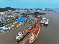 Workers are repairing ships in Zhoushan, China, on May 3, 2024. (