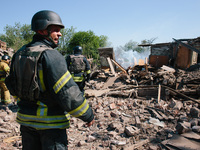 Firefighters are at the scene, in Kharkiv, Ukraine, on May 3, 2024 after the russian aerial bomb attack in Kharkiv.  (