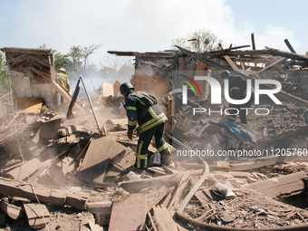 Firefighters are at the scene, in Kharkiv, Ukraine, on May 3, 2024 after the russian aerial bomb attack in Kharkiv.  (