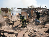 Firefighters are at the scene, in Kharkiv, Ukraine, on May 3, 2024 after the russian aerial bomb attack in Kharkiv.  (