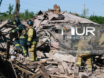 Firefighters are at the scene, in Kharkiv, Ukraine, on May 3, 2024 after the russian aerial bomb attack in Kharkiv.  (