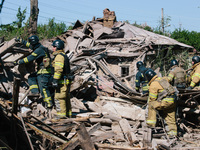 Firefighters are at the scene, in Kharkiv, Ukraine, on May 3, 2024 after the russian aerial bomb attack in Kharkiv.  (