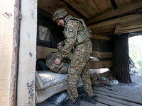 In Kharkiv Region, Ukraine, on May 3, 2024, Oleksii, who goes by the call sign Shershen (Hornet), is serving as a marksman and medic for the...