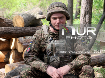 In Kharkiv Region, Ukraine, on May 3, 2024, Oleksii, who goes by the call sign Shershen (Hornet), is serving as a marksman and medic for the...