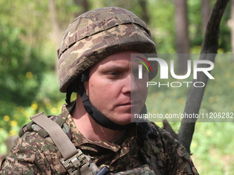 In Kharkiv Region, Ukraine, on May 3, 2024, Oleksii, who goes by the call sign Shershen (Hornet), is serving as a marksman and medic for the...