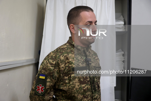 A military doctor of the 5th Slobozhanska Brigade of the National Guard of Ukraine, known by his call sign Morfin (Morphine), is providing m...