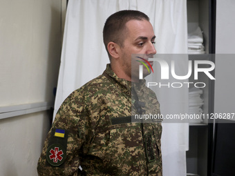 A military doctor of the 5th Slobozhanska Brigade of the National Guard of Ukraine, known by his call sign Morfin (Morphine), is providing m...