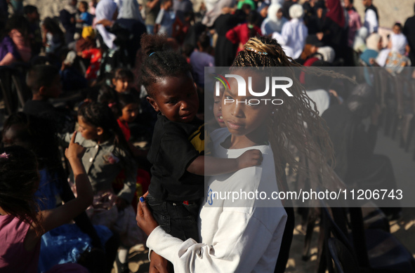 Displaced Palestinians are attending a mass wedding ceremony in Khan Yunis, in the southern Gaza Strip, on May 3, 2024, amid the ongoing con...