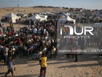 Displaced Palestinians are attending a mass wedding ceremony in Khan Yunis, in the southern Gaza Strip, on May 3, 2024, amid the ongoing con...