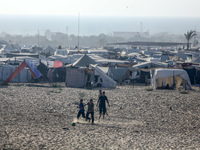 Displaced Palestinians are playing football next to their tents in Khan Younis, in the southern Gaza Strip, on May 3, 2024, amid the ongoing...