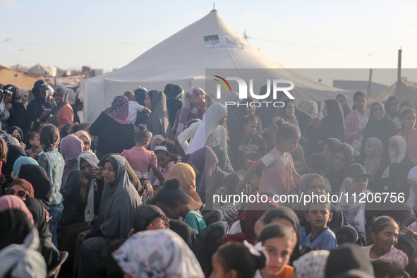 Displaced Palestinians are attending a mass wedding ceremony in Khan Yunis, in the southern Gaza Strip, on May 3, 2024, amid the ongoing con...