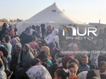 Displaced Palestinians are attending a mass wedding ceremony in Khan Yunis, in the southern Gaza Strip, on May 3, 2024, amid the ongoing con...