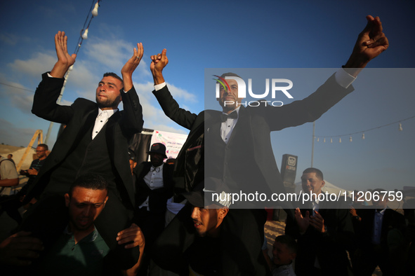 Displaced Palestinians are attending a mass wedding ceremony in Khan Yunis, in the southern Gaza Strip, on May 3, 2024, amid the ongoing con...