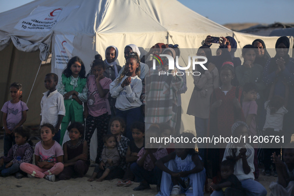 Displaced Palestinians are attending a mass wedding ceremony in Khan Yunis, in the southern Gaza Strip, on May 3, 2024, amid the ongoing con...