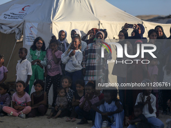 Displaced Palestinians are attending a mass wedding ceremony in Khan Yunis, in the southern Gaza Strip, on May 3, 2024, amid the ongoing con...