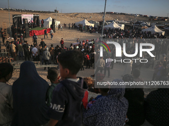 Displaced Palestinians are attending a mass wedding ceremony in Khan Yunis, in the southern Gaza Strip, on May 3, 2024, amid the ongoing con...