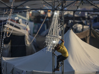 A Palestinian girl is attending a wedding among makeshift tents in Khan Younis, in the southern Gaza Strip, on May 3, 2024, amid the ongoing...