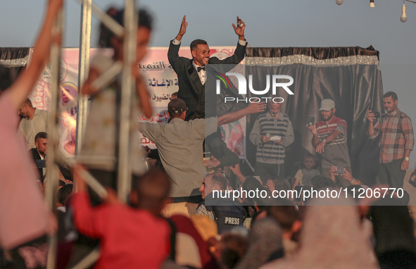 Grooms are celebrating during a mass wedding ceremony in Khan Yunis, in the southern Gaza Strip, on May 3, 2024, amid the ongoing conflict b...