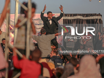 Grooms are celebrating during a mass wedding ceremony in Khan Yunis, in the southern Gaza Strip, on May 3, 2024, amid the ongoing conflict b...