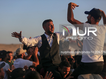 Grooms are celebrating during a mass wedding ceremony in Khan Yunis, in the southern Gaza Strip, on May 3, 2024, amid the ongoing conflict b...