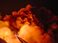 Firefighters are extinguishing the fire at the site of the drone attack in Kharkiv, Ukraine, on May 4, 2024. On the night of May 4, Russia a...