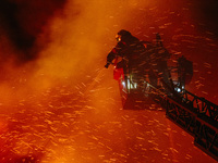 Firefighters are extinguishing the fire at the site of the drone attack in Kharkiv, Ukraine, on May 4, 2024. On the night of May 4, Russia a...