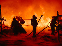 Firefighters are extinguishing the fire at the site of the drone attack in Kharkiv, Ukraine, on May 4, 2024. On the night of May 4, Russia a...