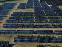 A drone is capturing images of photovoltaic power stations on both sides of the Beijing-Wei Expressway in Zhangjiakou, Hebei Province, China...