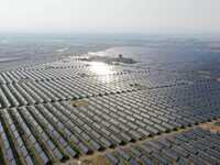 A drone is capturing images of photovoltaic power stations on both sides of the Beijing-Wei Expressway in Zhangjiakou, Hebei Province, China...