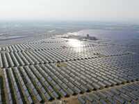 A drone is capturing images of photovoltaic power stations on both sides of the Beijing-Wei Expressway in Zhangjiakou, Hebei Province, China...