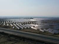 A drone is capturing images of photovoltaic power stations on both sides of the Beijing-Wei Expressway in Zhangjiakou, Hebei Province, China...